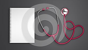 Medical and health care concept. Pink stethoscope and blank spiral notepad on grey background. 3D Rendering.