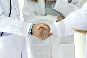 Medical and healthcare concept. Young medical people handshaking