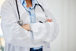 Medical healthcare doctor, woman worker or employee arms crossed standing confident with stethoscope in hospital