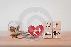 medical healthcare, health insurance, elderly care, pension, retirement concept. medical and health icon on wooden cube block