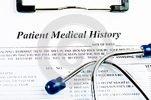 Medical history document with medicine and stethoscope