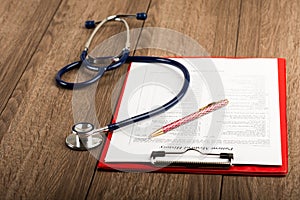 Medical history with stethoscope and pen