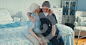 Medical, hugging and nurse with senior woman at a consultation in bedroom of nursing home. Healthcare, happy and young