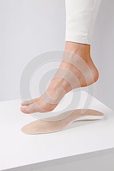 Medical insoles. Isolated orthopedic insoles on a white background. Treatment and prevention of flat feet and foot