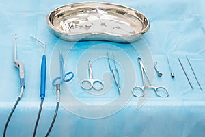 Medical instruments closeup on a sterile diaper. Surgical tools kit for cosmetic surgery. Surgical instruments and tools including