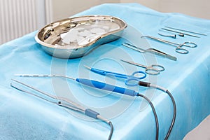 Medical instruments closeup on a sterile diaper. Surgical tools kit for cosmetic surgery. Surgical instruments and tools including