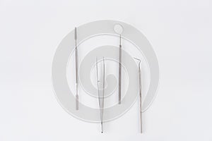 Medical instruments with mirror. Dentist tools on white isolated background.