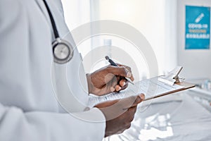 Medical, insurance and doctor filling out patient history for diagnosis at the hospital. Healthcare professional working