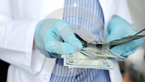 medical insurance, doctors\' income, financing of medics, doctor counts cash money dollars