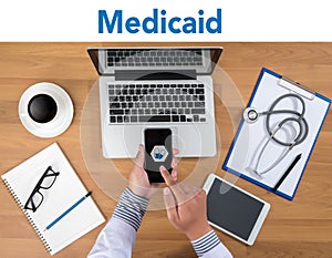 Medical insurance and Medicaid and stethoscope.