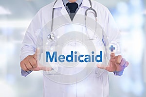 Medical insurance and Medicaid and stethoscope. photo