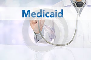 Medical insurance and Medicaid and stethoscope. photo