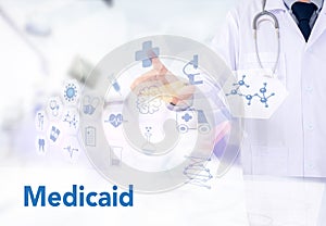 Medical insurance and Medicaid and stethoscope. photo