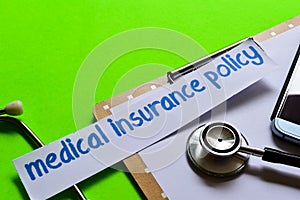 Medical insurance policy on Healthcare concept with green background