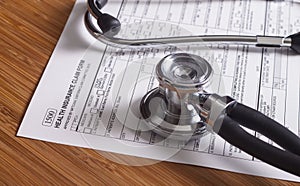 Medical insurance records, pen and Stethoscope