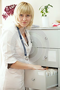 Medical intern searching for patient's records