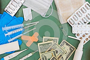 Medical items and money on table.