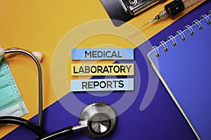 Medical Laboratory Reports text on Sticky Notes. Top view isolated on color background. Healthcare/Medical concept