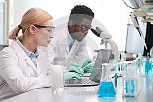Medical Laboratory Technicians Working at Desk