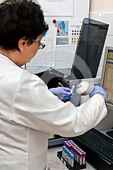 Medical laboratory worker taking infra red readout photo