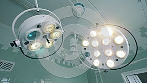 Medical lamps in a surgery room, close up. Medical facility.