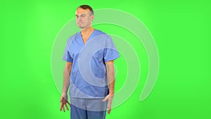 Medical man is waiting and angry. Green screen