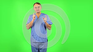 Medical man waiting in anticipation with pleasure. Green screen