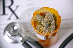 Medical marijuana concept with dry cannabis buds and stethoscope
