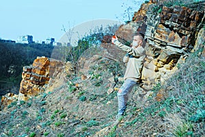 Medical mask as protection against coronavirus. guy in the mountains isolated from coronavirus