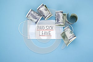 Medical mask with dollars and the words paid sick leave on a blue background
