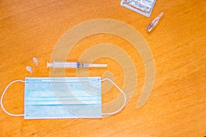 Medical mask with ear straps on white background. Medical tools health professionals.Disposable syringes