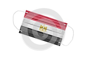 Medical mask with flag of egypt isolated on white background. The concept of the pandemic in Egypt. Attribute of a coronavirus