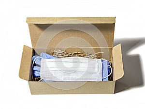 Medical mask and gloves are in a cardboard box