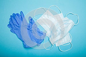 Medical mask and gloves. Blue background.