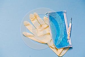 Medical mask on the latex gloves to protect from Covid-19 virus. Quarantene