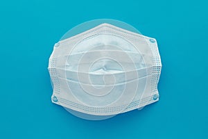 Medical mask, Medical protective masks on blue background. Disposable surgical face mask cover the mouth and nose. Healthcare and