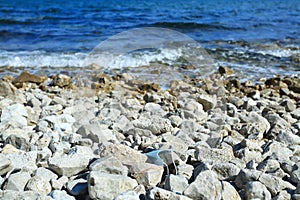 Medical mask used for COVID protection thrown on the beach resulting nature pollution and ecology problems