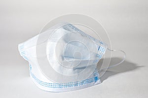 Medical mask on white background, disposable face mask for coronavirus protection. Selective focus