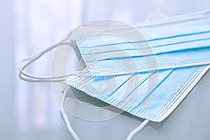 Medical masks on light gray background