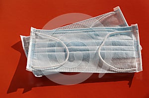 Medical masks on a red background. Respiratory protection