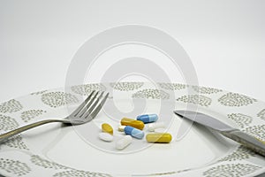 Medical meal of various colorful medicine drugs, pills, capsules, tablets. Concept for human eat a lot of drugs for everyday.
