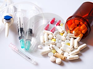 Medical and medicine kits with pills, saline tubes and needles.