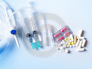 Medical and medicine kits with pills, saline tubes and needles.