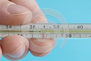 Medical mercury thermometer showing the temperature of 36.6 Â°C