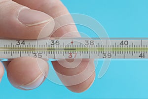 Medical mercury thermometer showing the temperature of 37.2 Â°C