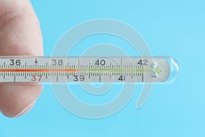 Medical mercury thermometer showing the temperature of 39 Â°C