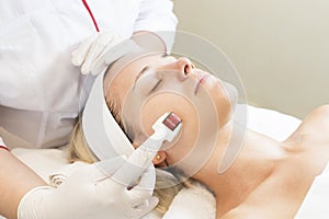 Medical micro needle therapy with a modern medical instrument derma roller.