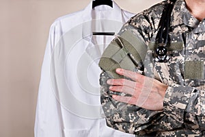 Medical military doctor with white consultation coat in background