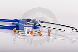 Medical miniature people, workers on medical equipment