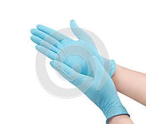 Medical nitrile gloves.Blue surgical gloves isolated on white background with hands. Rubber glove manufacturing, human hand photo